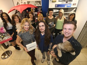 Front row from left; Buffy, Kyle Jahns, and Shael Lander in front of the 360 Hair and Nails staff.  Jahns, and the puppy, are with the Humane Society, the salon has teamed up to raise money for the Humane Society.  The event is called Cause for Paws.