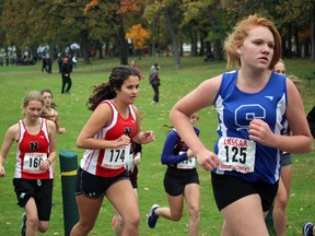 From right, Sarnia Collegiate's Sarah Benedictus is followed by the Northern duo of Cassandra Newall and Jessica Harris during the junior girl's race at the Lambton Kent high school cross country meet at Canatara Park  on Wednesday October 21, 2015 in Sarnia, Ont. (Terry Bridge, Sarnia Observer)
