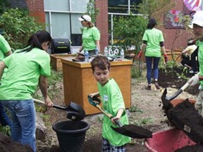 TELUS employees and their families volunteer together as part of their commitment to the community. (Free Te Children archives)