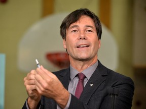 Health Minister Eric Hoskins with the flu vaccine nasal spray for Ontarian children. (Submitted)
