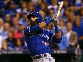 Jose Bautista of the Toronto Blue Jays hits a solo home run in the 4th inning against the Kansas City Royals during game 6 of the American League Championship Series at Kauffman Stadium in Kansas City, MO, USA. on Friday October 23, 2015. Dave Abel/Toronto Sun/Postmedia Network