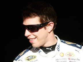 Brad Keselowski, driver of the #2 Miller Lite Ford, stands in the garage area during practice for the NASCAR Sprint Cup Series CampingWorld.com 500 at Talladega Superspeedway in Talladega, Ala., on Friday, Oct. 23, 2015. (Brian Lawdermilk/Getty Images/AFP)