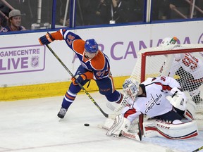 Connor McDavid is stopped at the side of the net by Capitals goalie Philipp Grubauer during the first period of Friday's game at Rexall Place. (Perry Mah, Edmonton Sun)