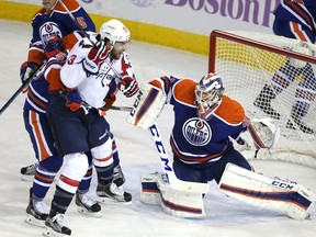 Oilers goalie Anders Nilsson stops Washington forward Tom Wilson during the first period of Friday's game at Rexall Place. (Perry Mah, Edmonton Sun)