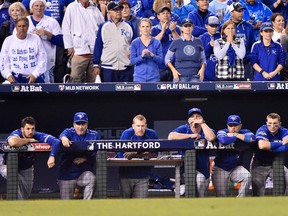 Toronto Blue Jays players watch from the dugout as they trail the Kansas City Royals during ninth inning game six American League Championship Series baseball action in Kansas City, Mo., on Friday, October 23, 2015. THE CANADIAN PRESS/Nathan Denette