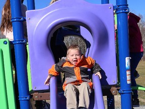 Benjamin LeGrand, 4, plays on a new play structure at C.R. Judd Public School in Capreol, Ont. on Friday October 23, 2015. The new outdoor structure and a sandbox were unveiled during a ceremony at the school. About $30,000 was raised through different fundraising initiatives spearheaded by parent volunteer Tracey LeGrand. There are plans to add shade trees and flowerbeds in the future. John Lappa/Sudbury Star/Postmedia Network