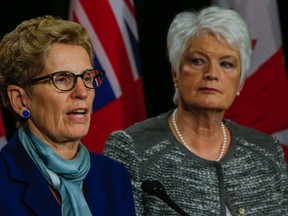 Premier Kathleen Wynne, along with Education Minister Liz Sandals, address media after meeting with teachers union reps at Queens Park on Oct. 23, 2015. (Dave Thomas/Toronto Sun)
