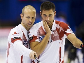 Canada's skip Pat Simmons and third John Morris line up a shot against the U.S. during the second draw of the World Men's Curling Championships in Halifax, Nova Scotia, March 28, 2015. (REUTERS/Mark Blinch)