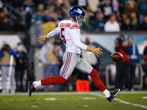 Steve Weatherford punts for the New York Giants during the second half of an NFL football game against the Philadelphia Eagles in Philadelphia. The Giants released popular punter Steve Weatherford on Friday, Sept. 4, 2015. (AP Photo/Michael Perez, File)