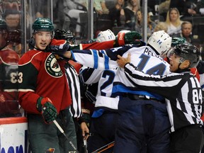 Minnesota Wild center Tyler Graovac (53) and Winnipeg Jets forward Anthony Peluso (14) exchange words during the second period at Xcel Energy Center. (Marilyn Indahl-USA TODAY Sports)