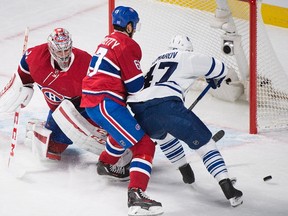 Canadiens goaltender Carey Price makes a save against on Maple Leafs forward' Leo Komarov during the first period in Montreal on Saturday night. (Graham Hughes/The Canadian Press)