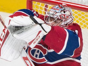 Canadiens goaltender Carey Price makes one of his 49 saves against the Maple Leafs during last night’s game in Montreal. The hosts won 5-3 thanks to Price. (THE CANADIAN PRESS)