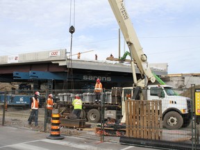 Crew members get ready for the next phase of the Kent Street Rapid Bridge replacement Hwy. 417 Saturday, Oct. 24, 2015.
JULIENNE BAY/Ottawa Sun