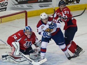 The Edmonton Oil Kings' Edgars Kulda (23) battles the Lethbridge Hurricanes' Kade Jensen (23) in front of Stuart Skinner (74) during third period WHL action at Rexall Place in Edmonton Alta., on Tuesday Feb. 3, 2015. Lethbridge won 4-3. David Bloom/Edmonton Sun/QMI Agency