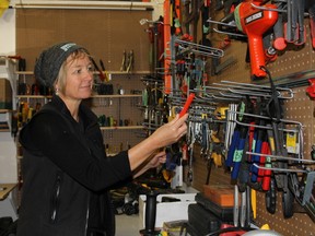 Ottawa Tool Library's co-founder Bettina Vollmerhausen looks through some of the 350 cataloged tools at 250 City Centre Ave. 
JULIENNE BAY/Ottawa Sun