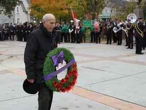 Nello Bortolotti of the Ottawa Italian Canadian Community Centre lays a wreath in Piazza Dante on Sunday, Oct. 25, 2015 during a ceremony honouring the  late Cpl. Nathan Cirillo.
JULIENNE BAY/Ottawa Sun