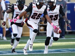 Ottawa Redblacks' Brandyn Thompson (25) celebrates his interception against the Winnipeg Blue Bombers during the first half of CFL action in Winnipeg Saturday, October 24, 2015. THE CANADIAN PRESS/John Woods