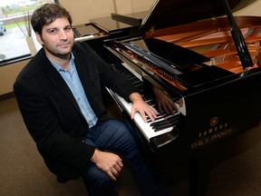 Darryl Fabiani, owner of D & S Pianos has donated about 30 pianos to good homes through his 88 Keys program. (MORRIS LAMONT, The London Free Press)