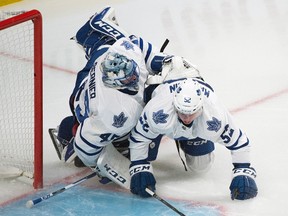 Toronto Maple Leafs goaltender Jonathan Bernier collides with teammate Martin Marincin during first period NHL hockey action against the Montreal Canadiens in Montreal on Oct. 24, 2015. (THE CANADIAN PRESS/Graham Hughes)