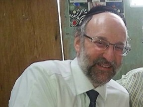 Canadian Howie Chaim Rotman is pictured holding his first grandchild in an undated family handout photo. An attack on a Jerusalem synagogue in 2014 that killed five people had also left Rotman fighting for his life. The Centre for Israel and Jewish Affairs said today that the 55-year-old dual Israeli-Canadian citizen succumbed to his injuries, leaving a wife and ten children. THE CANADIAN PRESS/HO