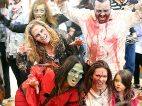 Six days before Halloween, around 50 Winnipeg dancers dressed in Zombie costumes perform a flash mob dance at St. Vital Mall. (Brian Donogh/Winnipeg Sun/Postmedia Network)
