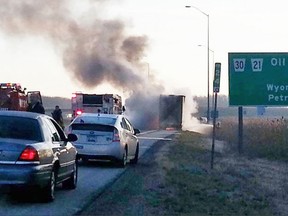 While the Ontario government pays municipalities to respond to fires, like this one involving a transport truck trailer on Hwy. 402, it doesn?t cover the cost of responding to false or ?no-service? alarms. (File photo)