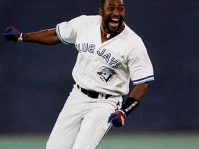 Toronto Blue Jays' Joe Carter celebrates as he runs the bases after his game-winning three-run home run to win the World Series at Skydome in Toronto on Oct. 23, 1993. (THE CANADIAN PRESS/Hans Deryk)