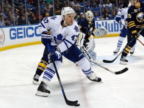 Toronto Maple Leafs center Leo Komarov brings the puck from behind the Buffalo Sabres net during the third period at First Niagara Center in Buffalo on Oct. 21, 2015. (Kevin Hoffman/USA TODAY Sports)