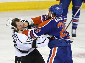 Edmonton Oilers’ Luke Gazdic (20) connects with a right on LA Kings Kyle Clifford (13) during Sunday’s NHL game at Rexall Place (Perry Mah, Edmonton Sun).