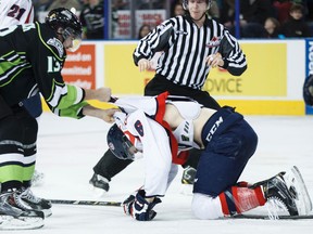 Edmonton forward Brandon Baddock (13) pulls Lethbridge defenseman Andrew Nielsen (6) off centre Andrew Koep (15) after a hit to the head from Nielsen during the second period of a WHL game between the Edmonton Oil Kings and the Lethbridge Hurricanes at Rexall Place in Edmonton, Alta., on Friday, Jan. 2, 2015. Ian Kucerak/Edmonton Sun/ QMI Agency