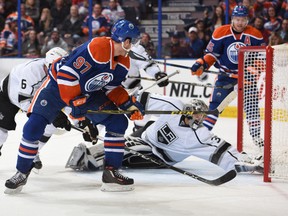 Edmonton Oilers' Connor McDavid (97) watches as the puck cross the goal line past LA Kings goalie Jonathan Quick (32) during third period NHL action at Rexall Place in Edmonton, Alberta on October 25, 2015. Dale MacMillan/Edmonton Sun/Postmedia Network