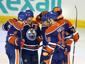 Edmonton Oilers celebrate Taylor Hall's goal during third period NHL action at Rexall Place in Edmonton, Alberta on October 25, 2015. Perry Mah/Edmonton Sun/Postmedia Network
