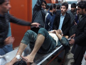 A patient is brought to a hospital after a severe earthquake was felt in Mingora, the main town of Pakistan Swat valley, on Oct. 26, 2015. (AP Photo/Naveed Ali)