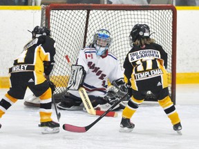 Alissa Insley (left) and Haileigh Templeman of the Mitchell Novice HL team find themselves in close scoring range during action against Kitchener from the 10th annual Mitchell Girls Hockey tournament last Friday, Oct. 23. ANDY BADER/MITCHELL ADVOCATE