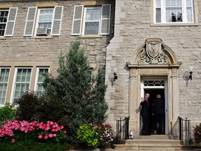 Canadian astronaut Chris Hadfield waves as he enters 24 Sussex Drive in Ottawa June 10, 2013 during a visit with Prime Minister Stephen Harper. REUTERS/Blair Gable