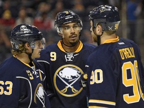 From left to right: Tyler Ennis #63, Evander Kane #9, and Ryan O'Reilly #90 of the Buffalo Sabres talk in-between whistles during a game against the Ottawa Senators at the First Niagara Center on September 23, 2015 in Buffalo, New York. (Tom Brenner/ Getty Images/AFP)