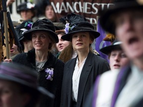 In this image released by Focus Features, Anne-Marie Duff portrays Violet Miller, left, and Carey Mulligan portrays Maud Watts in a scene from "Suffragette." (Steffan Hill/Focus Features via AP)