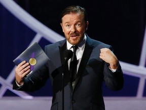 Ricky Gervais presents an award during the 66th Primetime Emmy Awards in Los Angeles, California in this file photo taken August 25, 2014.  British comedian Gervais will host the Golden Globes ceremony in 2016 for a fourth time, organizers said on Monday.  REUTERS/Mario Anzuoni/Files