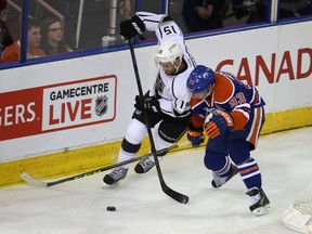 Ryan Nugent-Hopkins battles KIngs' Andy Andreoff for the puck Sunday at Rexall place. Taylor Hall says if the Oilers keep playing as hard as they did in that game, the wins will come. (Perry Mah, Edmonton Sun)