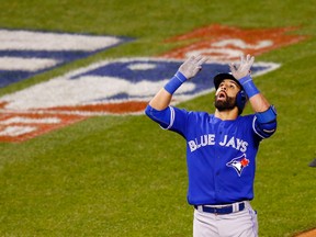 Toronto Blue Jays' Jose Bautista celebrates his two run home run against the Kansas City Royals during the eighth inning in Game 6 of baseball's American League Championship Series on Friday, Oct. 23, 2015, in Kansas City, Mo. (AP Photo/Paul Sancya)