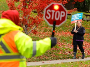 Elementary school teachers hold an information picket, one of three information rallies by teachers with the Kawartha Pine Ridge District School Board, on Wednesday October 21, 2015 outside Prince of Wales Public School in Peterborough, Ont. The Elementary Teachers' Federation of Ontario (EFTO) union has been in strike action for 25 weeks and without a contract for over a year. Clifford Skarstedt/Peterborough Examiner/Postmedia Network