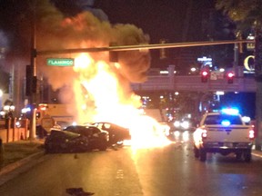 In this Feb. 21, 2013 file photo, smoke and flames billow from a burning vehicle following a shooting and multi-car accident on the Las Vegas Strip in Las Vegas. (AP Photo/Erik Lackey, File)
