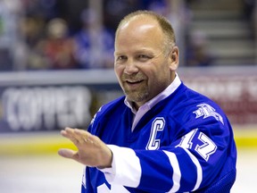 Former Toronto Maple Leafs great Wendel Clark waves to fans as he walks to centre ice to drop the puck at the NHL Rookie Tournament at Budweiser Gardens in London, Ont. on Sept. 11, 2015. (Craig Glover/The London Free Press/Postmedia Network)
