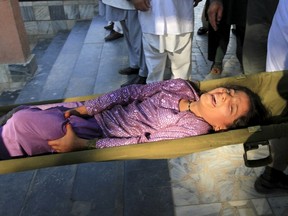 Rescue workers carry a girl who was injured after an earthquake, at a hospital in Jalalabad, Afghanistan, October 26, 2015. A powerful earthquake struck a remote area of northeastern Afghanistan on Monday, shaking the capital Kabul, as shockwaves were felt in northern India and in Pakistan's capital, where hundreds of people ran out of buildings as the ground rolled beneath them. REUTERS/ Parwiz