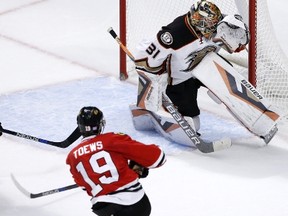 Chicago Blackhawks center Jonathan Toews (19) shoots the winning goal past Anaheim Ducks goalie Frederik Andersen during the overtime period of an NHL hockey game Monday, Oct. 26, 2015, in Chicago. The Blackhawks won 1-0. (AP Photo/Charles Rex Arbogast)