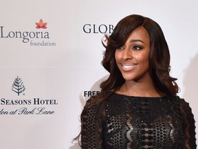 British singer Alexandra Burke poses as she arrives at the 5th annual London Global Gift Gala in London on November 17, 2014.  AFP PHOTO / LEON NEAL