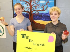 London Road Public School eighth grade students Jessa Clark and Bryce Lachapelle celebrated Lambton County's Great Big Crunch by creating a poster and eating an apple. 
CARL HNATYSHYN/SARNIA THIS WEEK