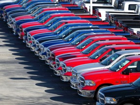 Dodge Ram pickup trucks are on display on the lot at Landmark Dodge Chrysler Jeep Ram, in Morrow, Ga., in this Jan. 5, 2015, file photo. Fiat Chrysler announced, Tuesday, Oct. 27, 2015, that it’s recalling more than 86,000 Ram pickups mainly in North America because the rear axle shafts could break and cause a wheel to separate. Most of the 2015 and 2016 Rams are still at dealers. (AP Photo/John Bazemore, File)