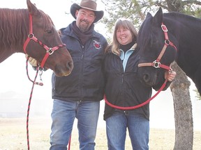 Robin Reeve and Roxanne Lambert, pictured here with two of their horses, Rosa and Raven, are the local owners of 4-R-Equine, a group that offers equine-assisted personal development and equine emergency first-aid training.