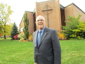 Roger Ellis stands on Tuesday October 27, 2015 in Sarnia, Ont., outside of Redeemer Lutheran Church on Indian Road. He is set to retire from the church where he has served since 1979. (Paul Morden/Sarnia Observer/Postmedia Network)